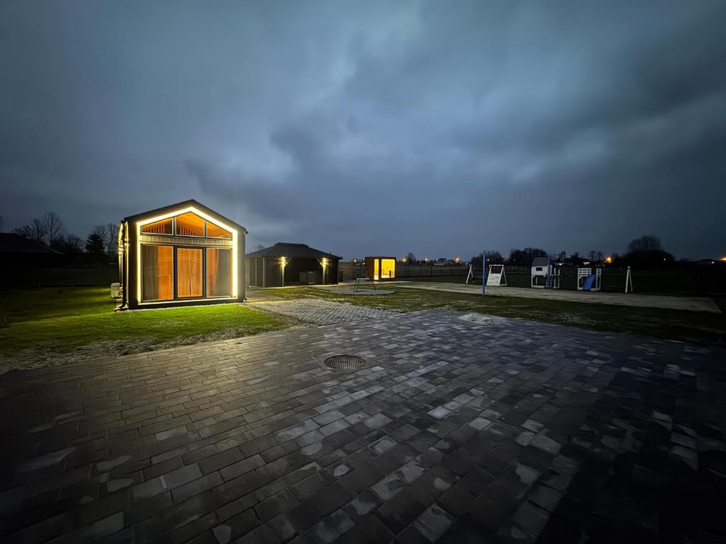 a house is lit up at night at Pniówek Chill in Zamość