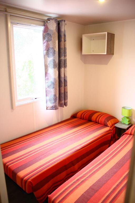 Ein Bett oder Betten in einem Zimmer der Unterkunft Camping Edy