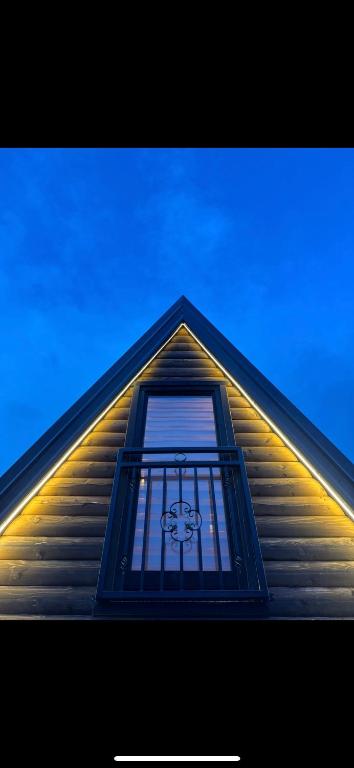 a building with a window with a teddy bear on it at Tara Lux 2 in Mojkovac
