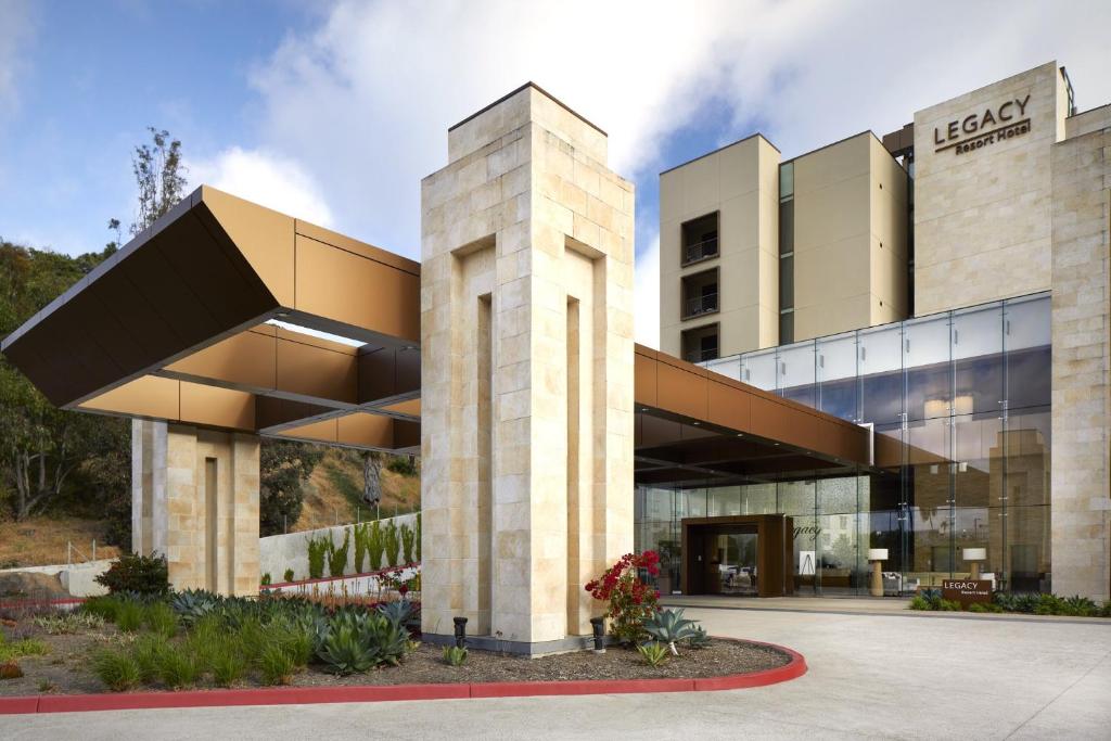 a rendering of a building with a glass facade at Legacy Resort Hotel & Spa in San Diego