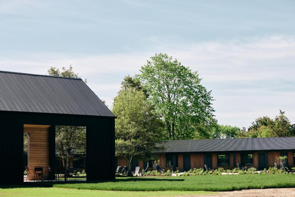 a black house with a black roof at Three Ducks in Westhampton
