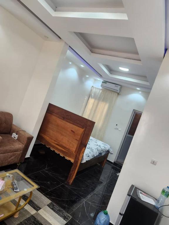 a living room with a couch and a table at Gassama studio in Dakar