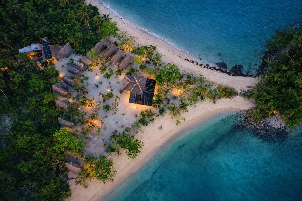 an aerial view of a resort on a beach at Dos Playa EcoCamp Daracoton Island in El Nido