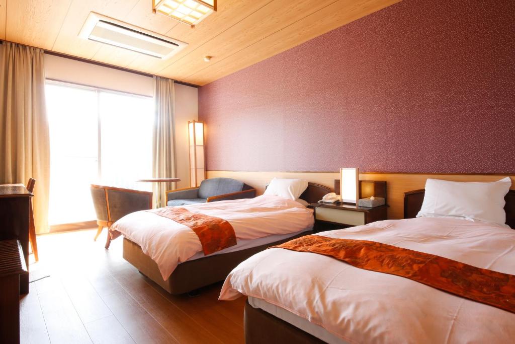 Letto o letti in una camera di Hinotani Onsen Misugi Resort
