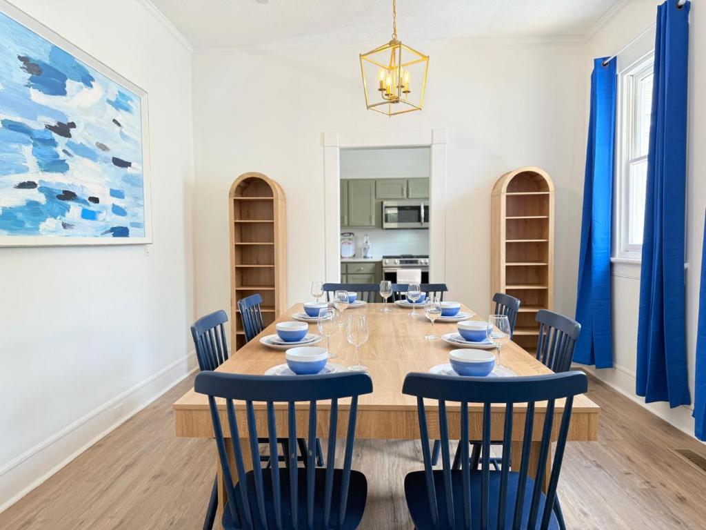 a dining room with a long table and chairs at Spacious 4BR Home Pool and Comfort in Columbus