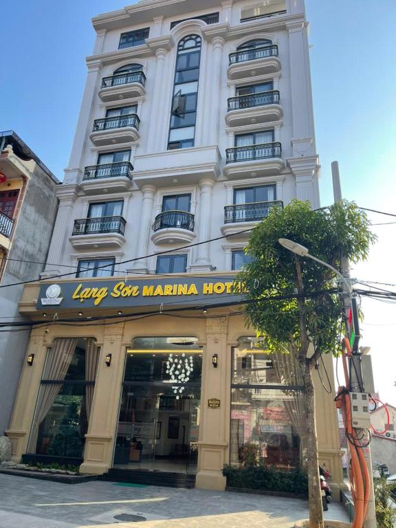 a large white building with a sign on it at Lạng Sơn Marina Hotel in Lạng Sơn