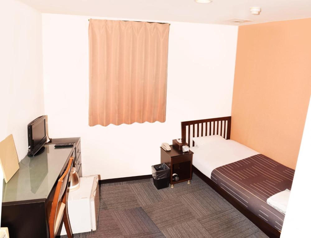 TV a/nebo společenská místnost v ubytování Sakura Hotel Oami