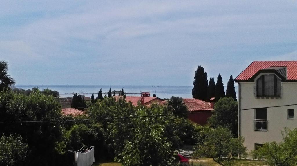 a view of the ocean from a house at Apartments Zambratija in Zambratija