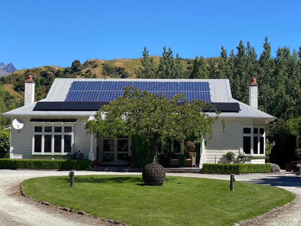 a house with solar panels on the roof at Resort Arrowtown in Arrowtown