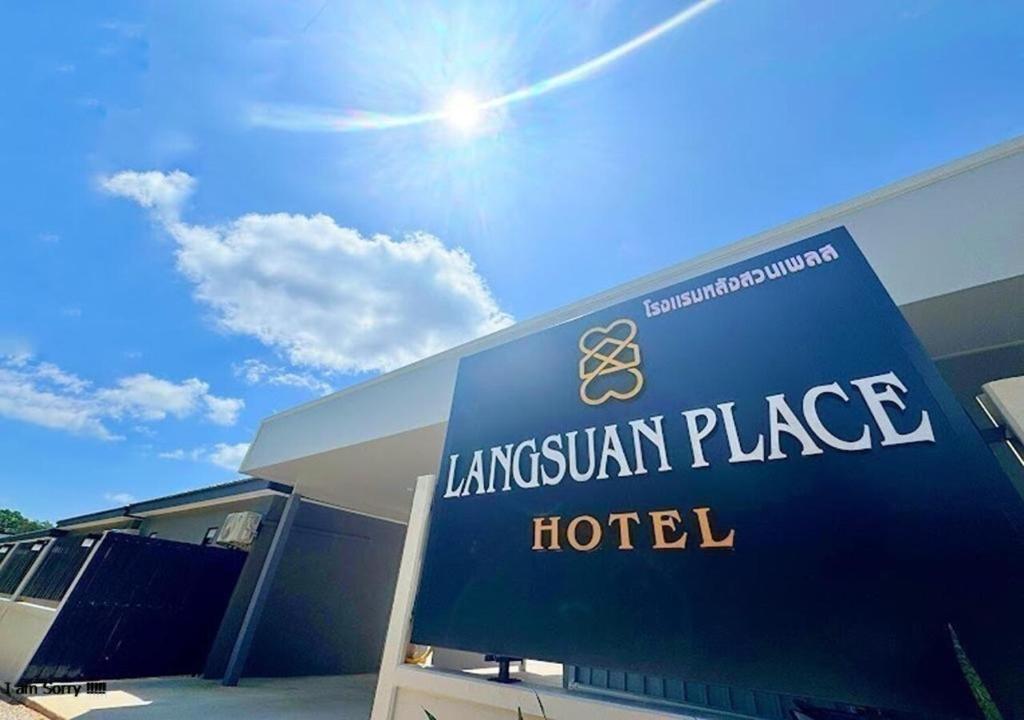 a sign for the lancashire embassy place hotel at โรงแรมหลังสวนเพลส Langsuan place Hotel in Lang Suan