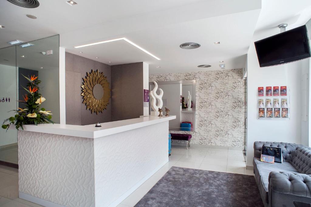 TV a/nebo společenská místnost v ubytování Hotel Genesis