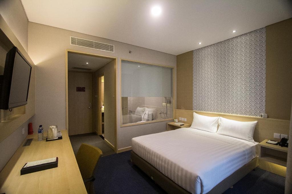 Postel nebo postele na pokoji v ubytování GTV Hotel