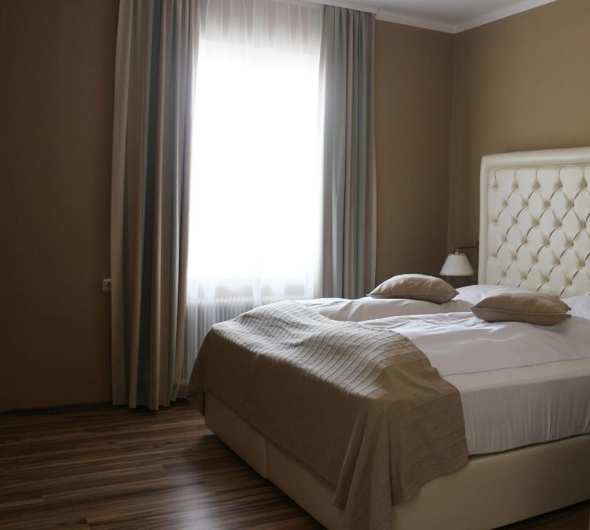 Posteľ alebo postele v izbe v ubytovaní Residenz am See
