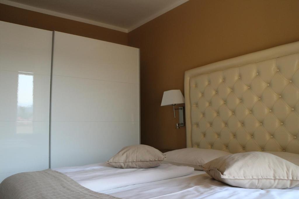 Posteľ alebo postele v izbe v ubytovaní Residenz am See