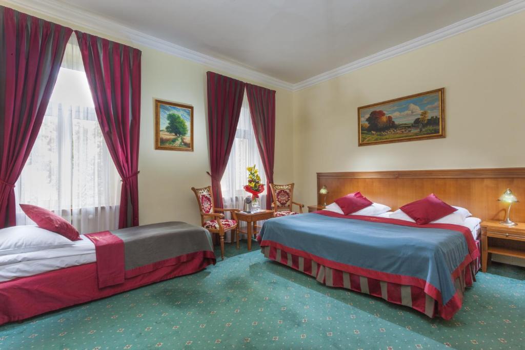 Postel nebo postele na pokoji v ubytování Green Garden Hotel