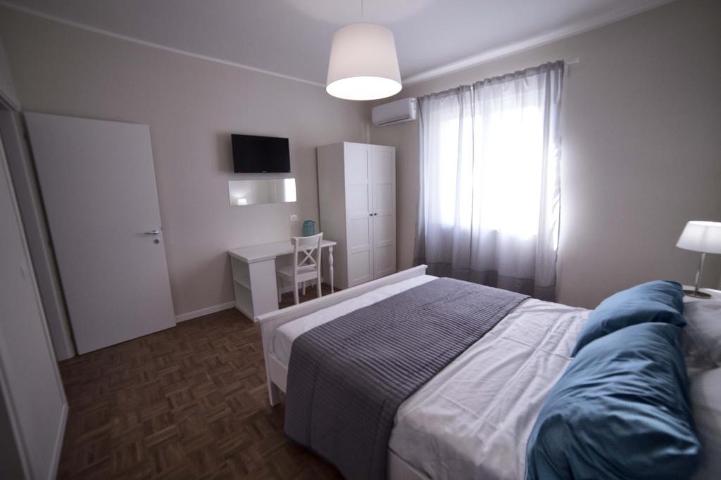 a small bedroom with a bed and a window at Home Scala dei Turchi B&B in Realmonte