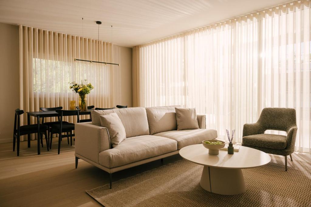 a living room with a couch and a table at Pinewood by Holistays in İncirli