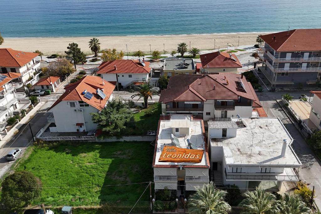 an aerial view of a resort with the beach at Villa Leonidas in Nea Vrasna