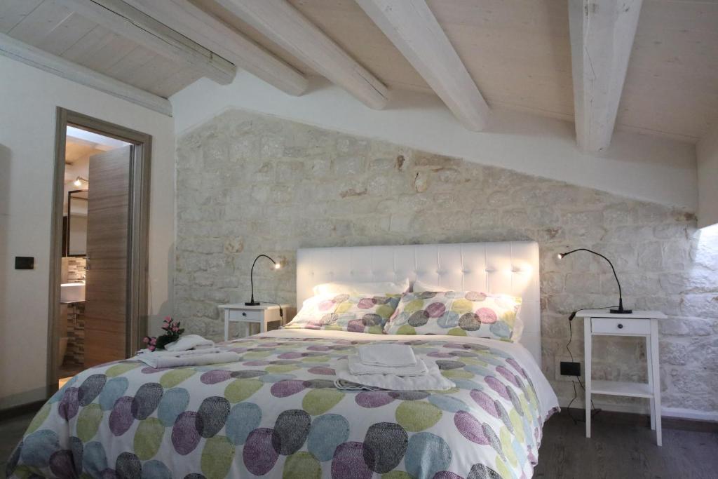 Łóżko lub łóżka w pokoju w obiekcie Villa Antica Aia Relax