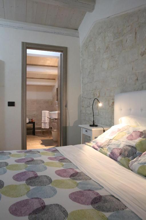 Łóżko lub łóżka w pokoju w obiekcie Villa Antica Aia Relax