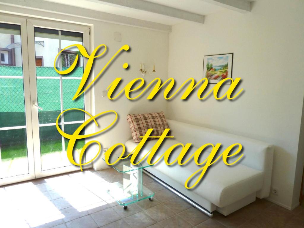 a living room with a couch and a sign that reads trend exchange at Vienna Cottage in Vienna