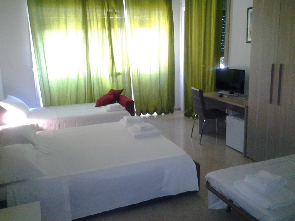 Posteľ alebo postele v izbe v ubytovaní Olimpica Relais guest house