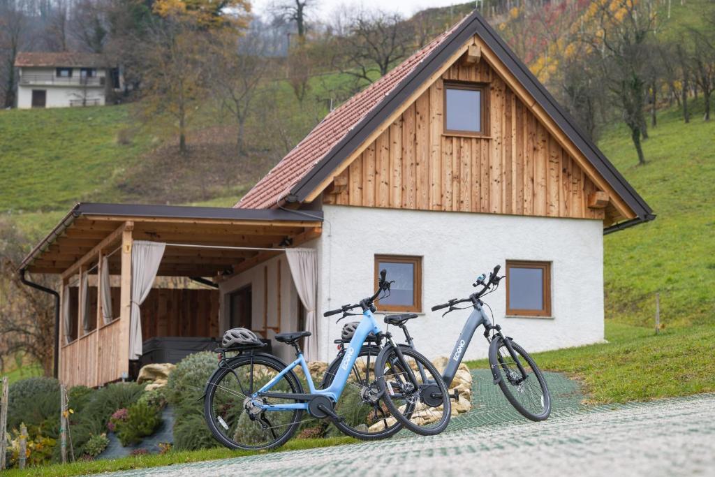 two bikes parked in front of a house at Glamping Podgoro with private hot tube - Rogatec in Rogatec