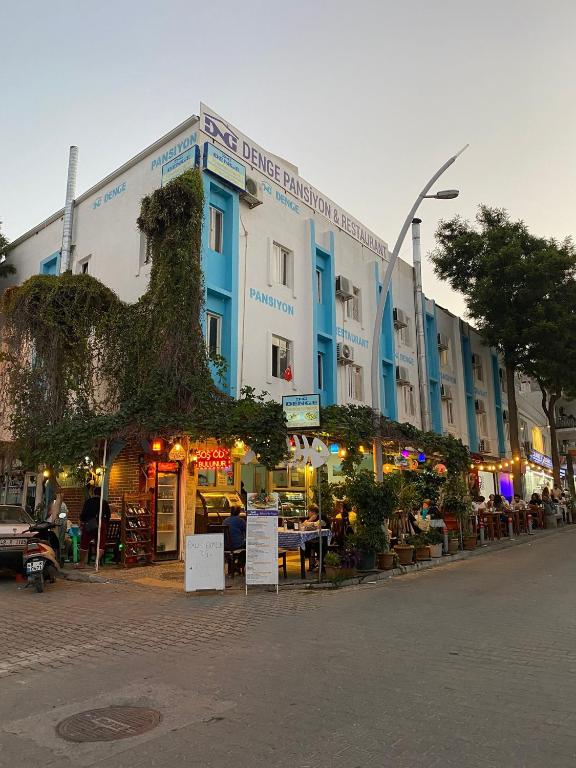 a blue and white building on a city street at denge pansiyon in Datca