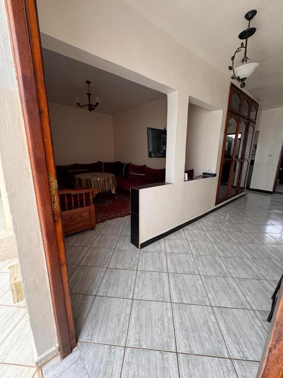 a living room with a couch and a room with a floor at Tamraght Waves Retreat 2 in Tamraght Ouzdar