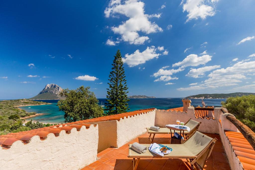a view of the ocean from the balcony of a villa at Hotel Don Diego in Porto San Paolo