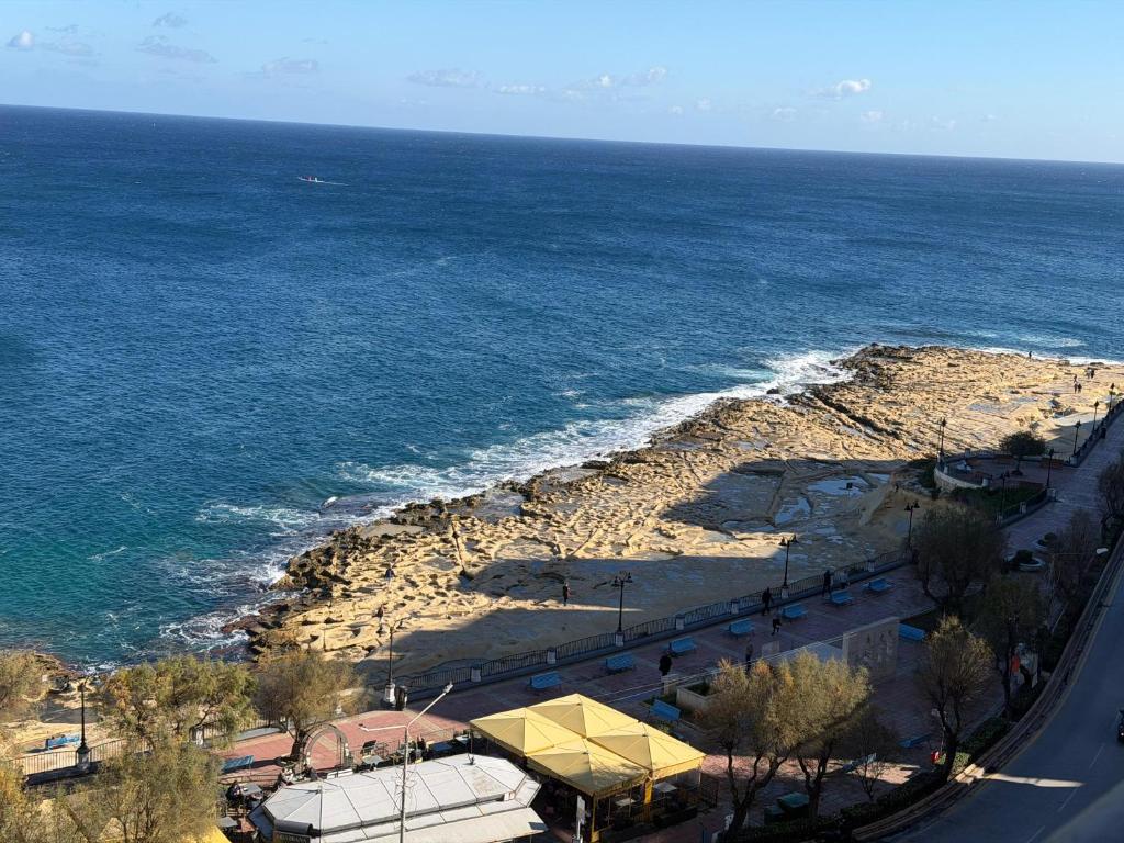 an aerial view of a beach and the ocean at Vista Mare Sliema in Sliema