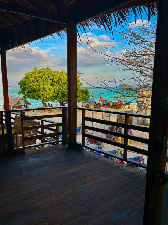 a view of the beach from the porch of a resort at Lipe BeachHouse in Ko Lipe