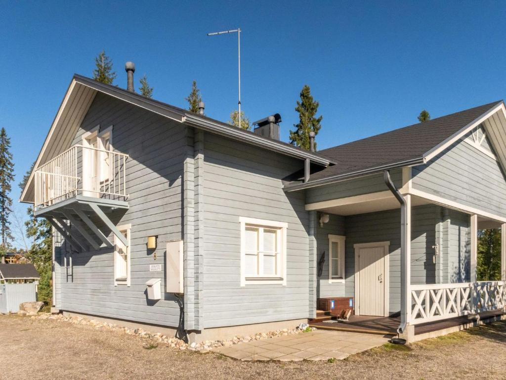 a house with a balcony on the side of it at Holiday Home Noukatti by Interhome in Lahdenperä
