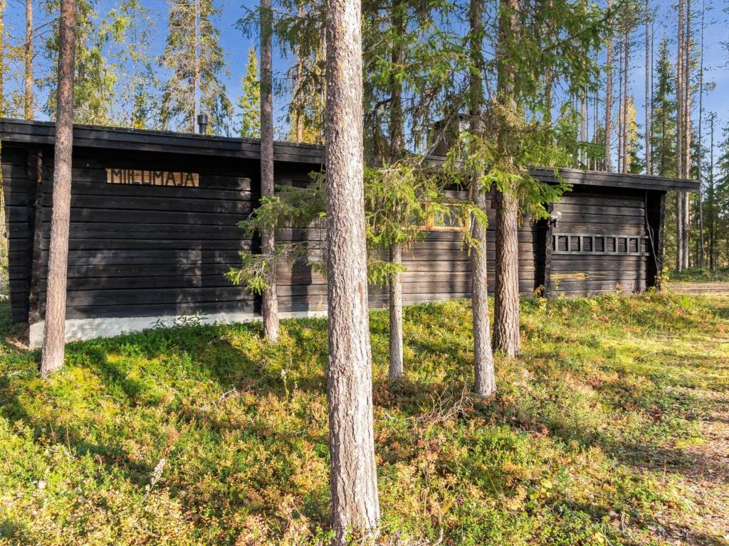 a log cabin in the woods with trees at Holiday Home Miilumaja by Interhome in Äkäslompolo