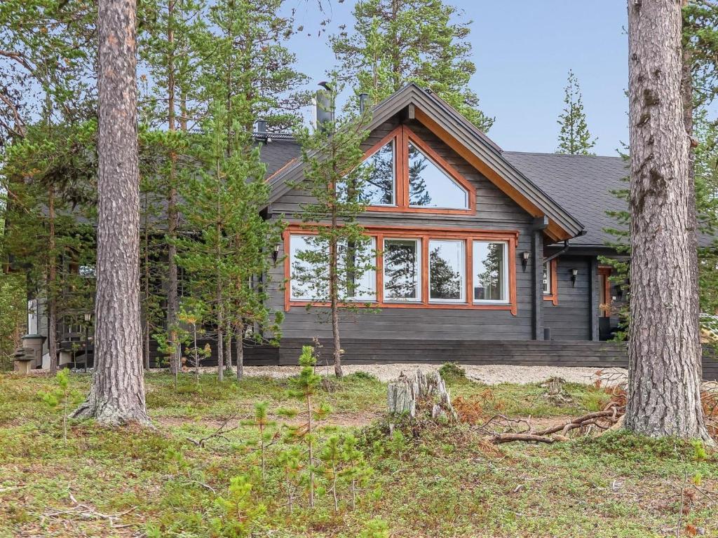 a house in the woods with trees at Holiday Home Homma by Interhome in Kyrö