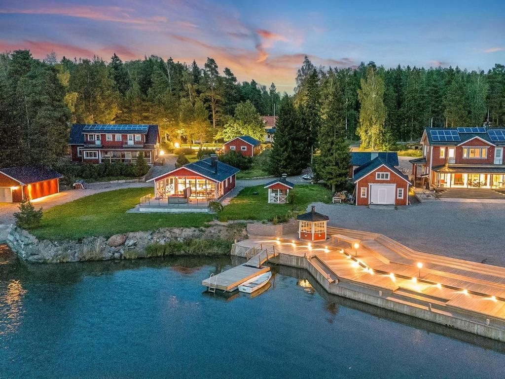 an aerial view of a home with a dock in the water at Holiday Home Villa blomvik by Interhome in Kristenäs