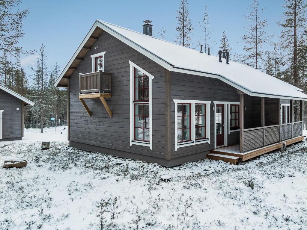 a small house in the snow in the woods at Holiday Home Maaruska a by Interhome in Äkäslompolo