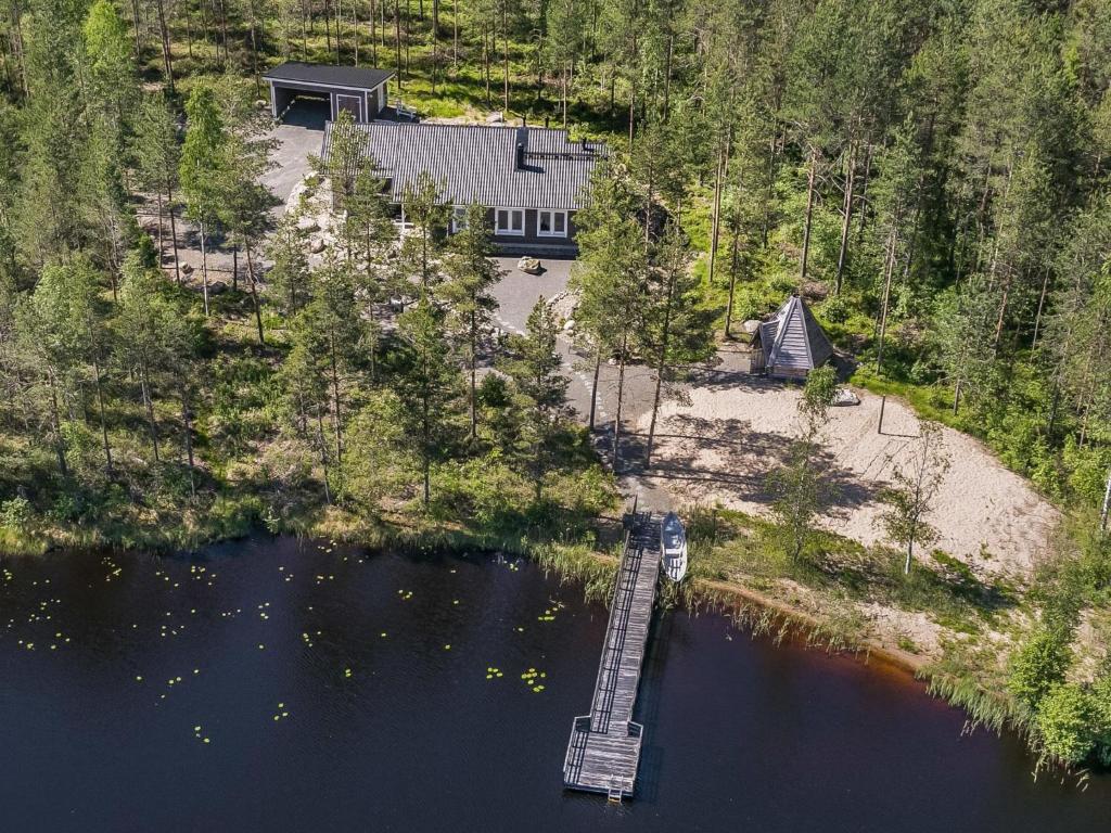 an aerial view of a house with a dock in the water at Holiday Home Kalaranta by Interhome in Lihavanpää
