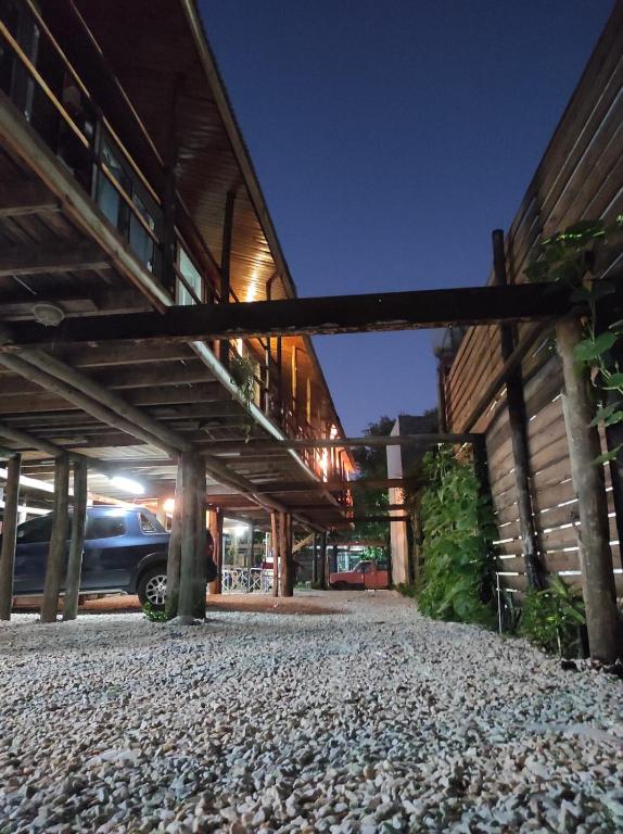 a car parked under a building at night at Cabañas del Rio in Gualeguaychú