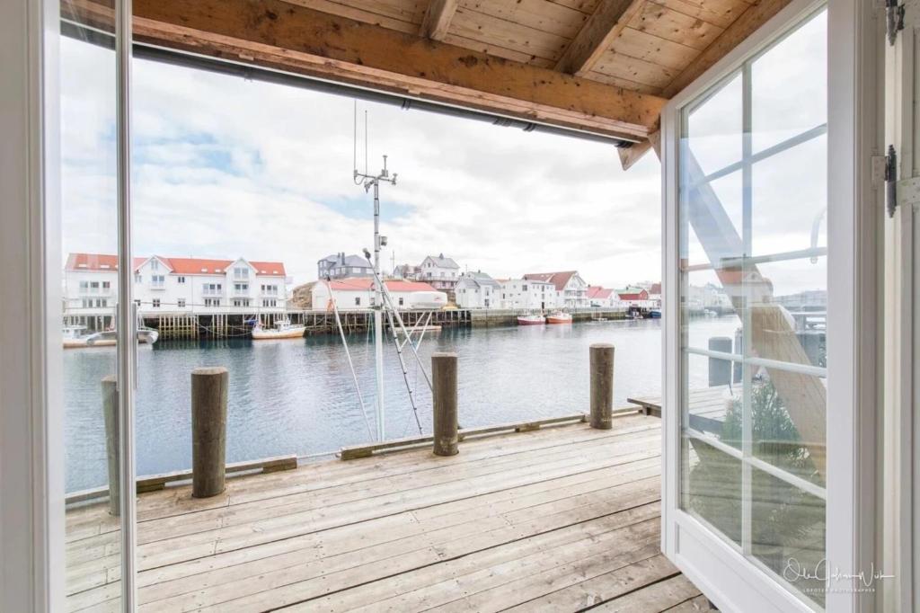 a balcony with a view of the water at Hellandsøy apartment, Henningsvær in Henningsvær