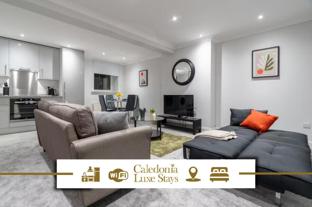 a living room with a couch and a table at Bell Apartment in Airdrie