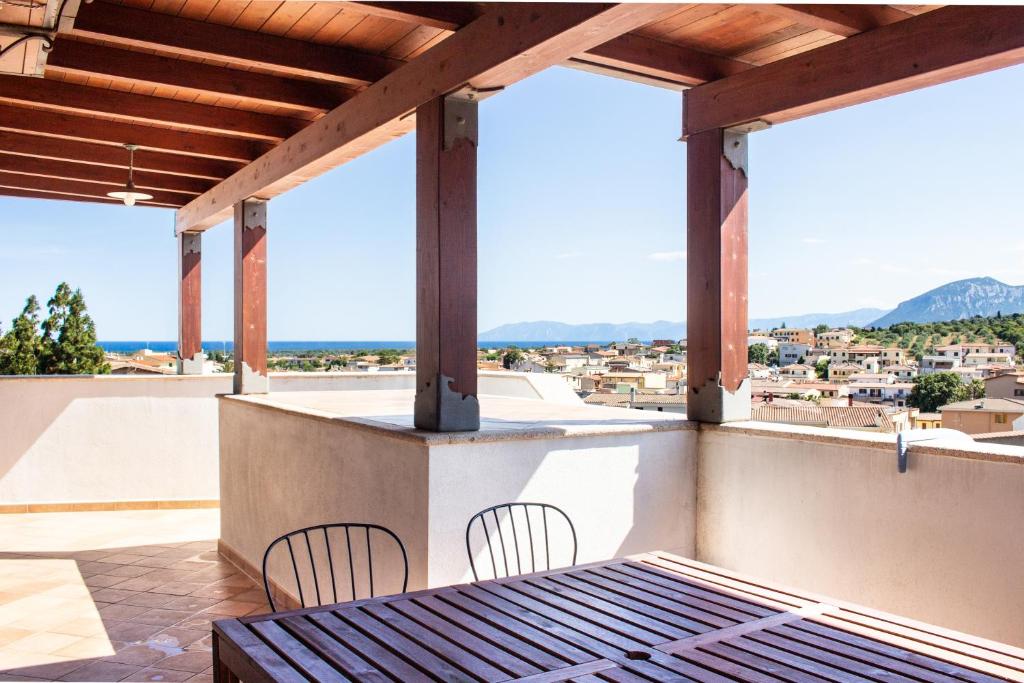 a view from the balcony of a house with a table and chairs at Residenze Branca III SeaView in Orosei
