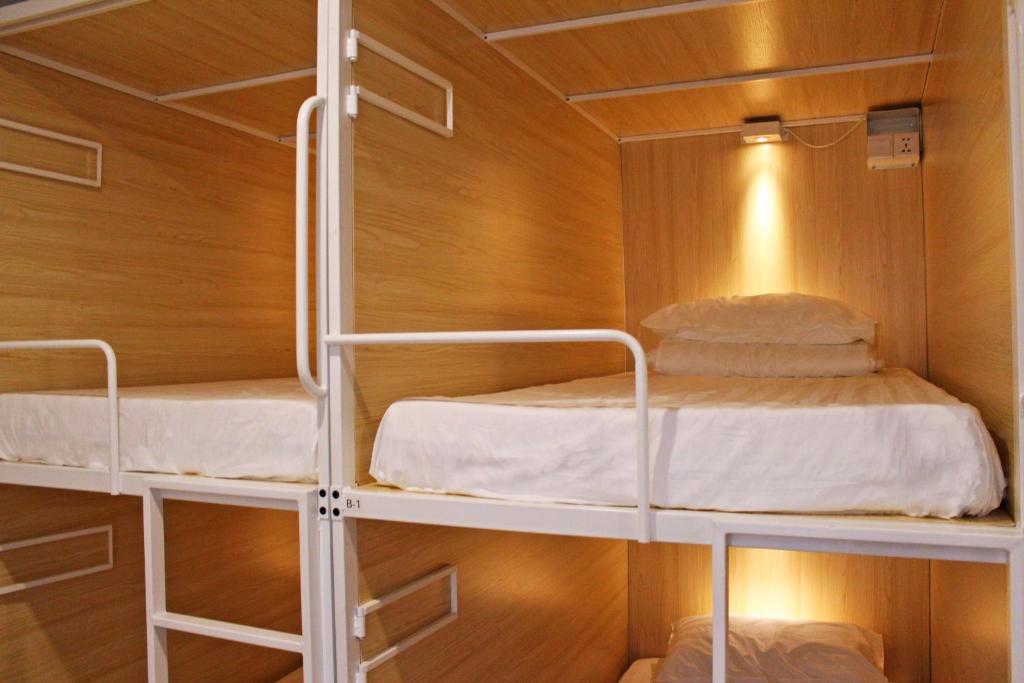 Postel nebo postele na pokoji v ubytování Onederz Hostel Hangzhou