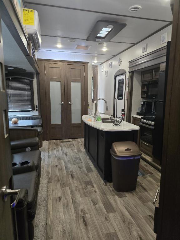 an rv kitchen with a sink and a counter at Courtside Villa at Key Largo in Key Largo