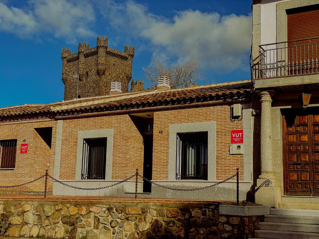 a brick building with a tower on top of it at Casa Luna del Prado, Cerca de Puy Du Fou in Guadamur