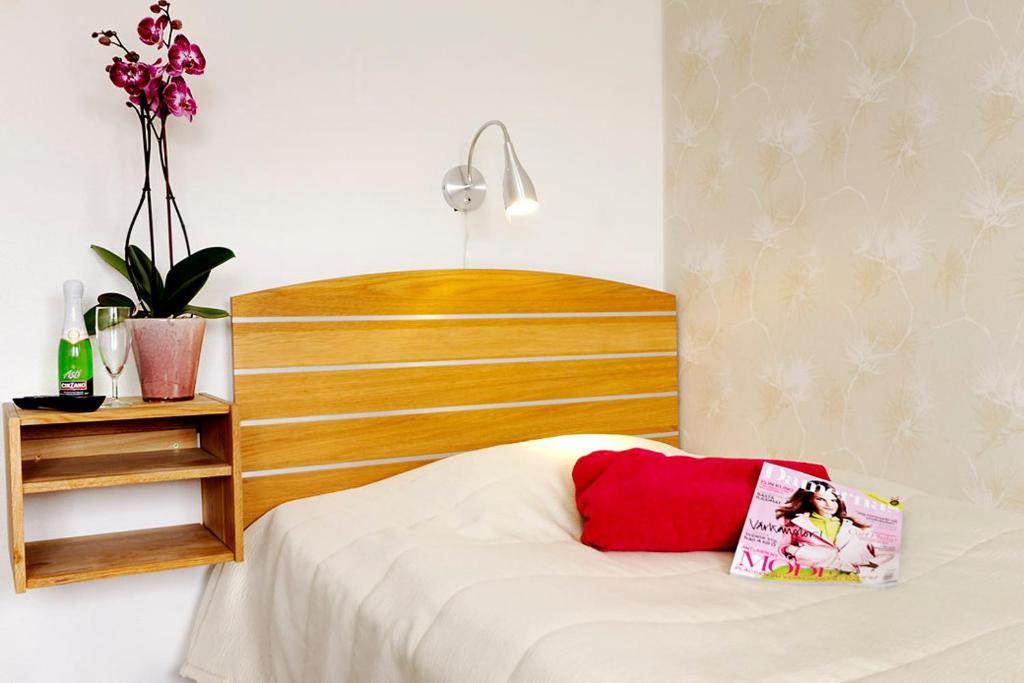 Postel nebo postele na pokoji v ubytování Hotell City