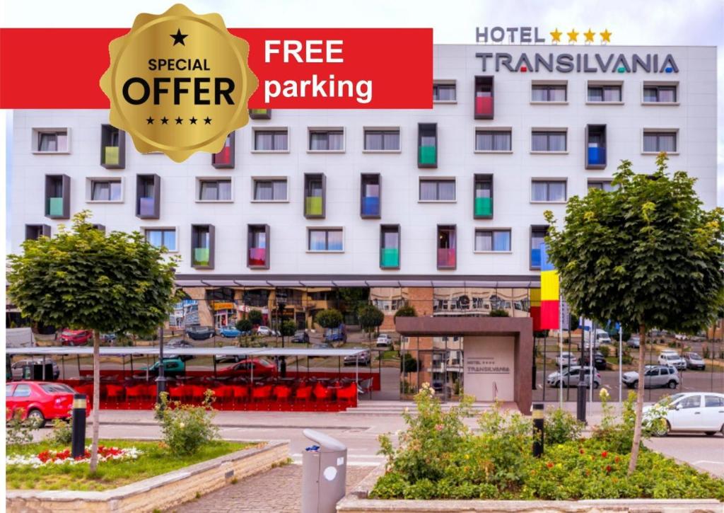 a hotel with a sign that reads free special offer parking at Hotel Transilvania in Alba Iulia