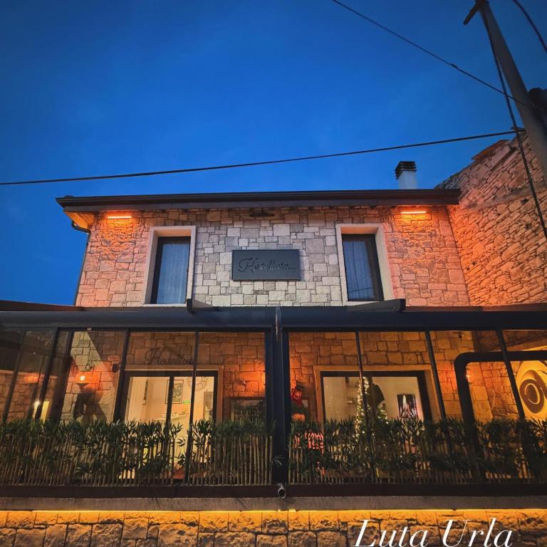 a brick building with windows on the side of it at LUTA Urla in Urla