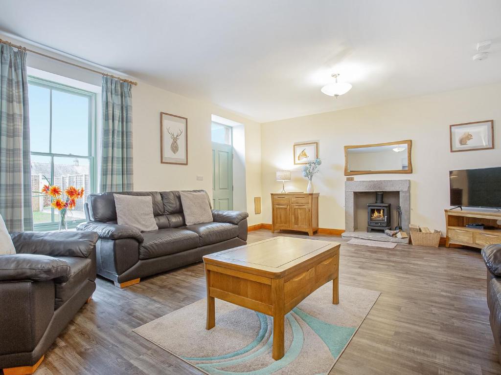 a living room with a couch and a table at The Knott - Uk49161 in Silverdale
