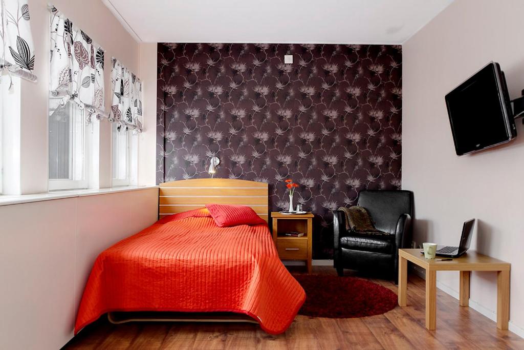 Postel nebo postele na pokoji v ubytování Hotell City